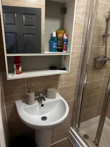 a bathroom with a sink and a shower at WoolPack in Huddersfield