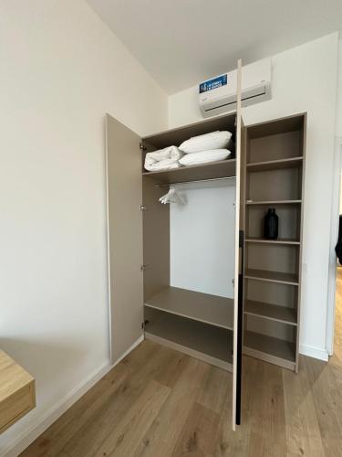 a walk in closet in a room with white walls at Apartment suite Mukachevo in Mukacheve
