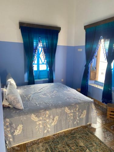 Ein Bett oder Betten in einem Zimmer der Unterkunft Hotel Ahrazem