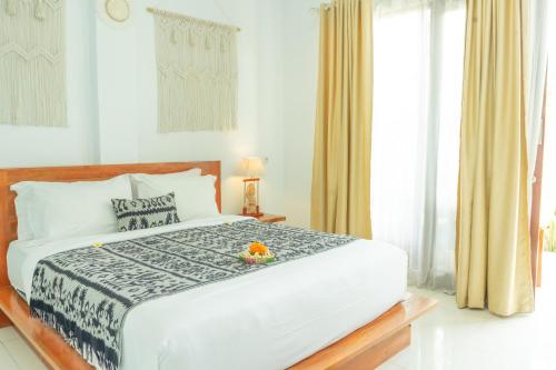 Кровать или кровати в номере Amalla Lodge Penida by Omanera