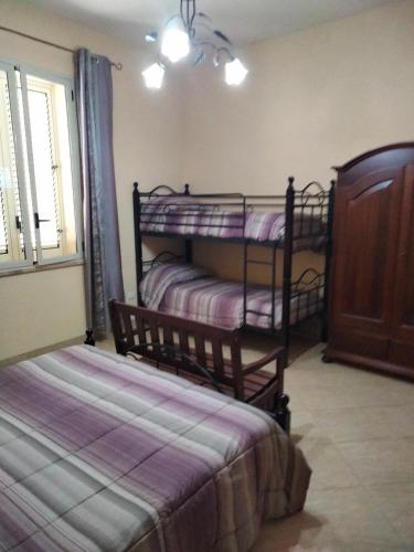 Postel nebo postele na pokoji v ubytování THE BEST ROOMS & APARTMENTS - Parcheggia gratis sotto casa ed entra -