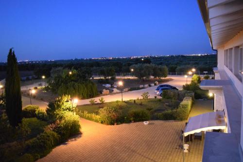 a view of a parking lot at night at Zyra Garden Club in Acquaviva delle Fonti