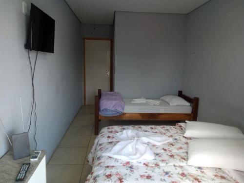 Ένα ή περισσότερα κρεβάτια σε δωμάτιο στο Hotel Caçula Do Pampa
