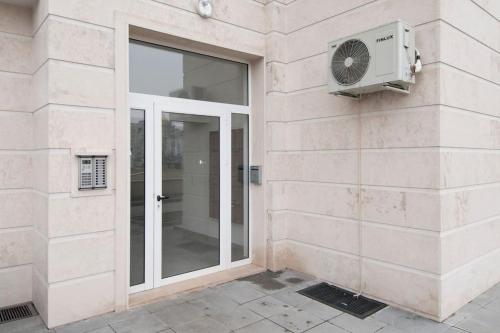 a building with a window and a fan at Sofia Top Apartments in Sofia