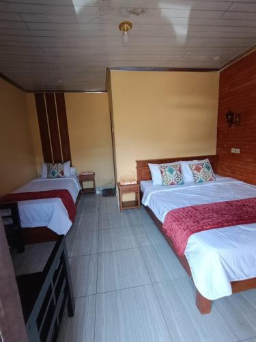 Postel nebo postele na pokoji v ubytování Oryza villa