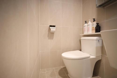 a bathroom with a white toilet in a room at Manso Hostel in DDP in Seoul