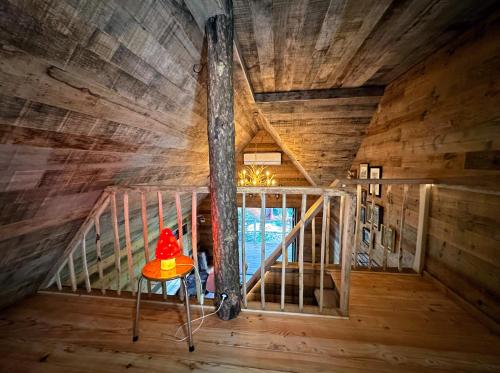 an inside view of a room in a log cabin at New Unique Treehouses with hot tub in Oisterwijk in Oisterwijk