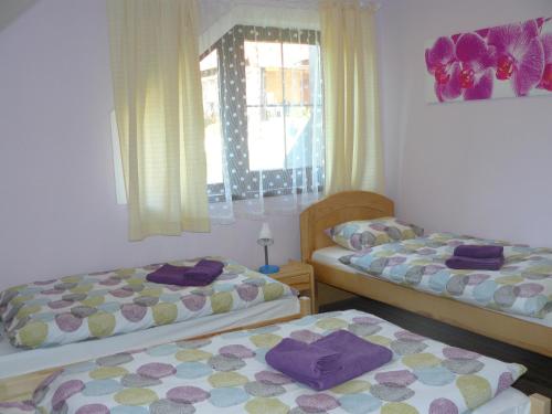 A bed or beds in a room at Privát Za Lesíkom