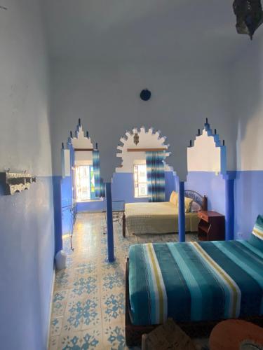 Ein Bett oder Betten in einem Zimmer der Unterkunft Hotel Ahrazem