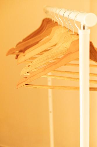 a pile of wood hanging on a rack at Alivio - Thuiskomen bij jezelf op vakantie in Lummen
