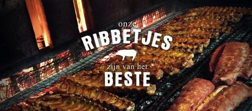 a display of different types of meat on a rack at Ruime en Zonnige 5 sterren Vakantiewoning SVN7tien in Doornhoek