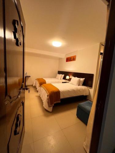 Postel nebo postele na pokoji v ubytování PisonayMapiHotelBoutique