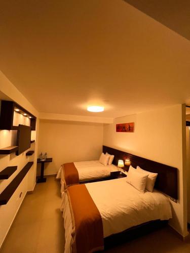 Postel nebo postele na pokoji v ubytování PisonayMapiHotelBoutique