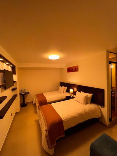 Postel nebo postele na pokoji v ubytování PisonayMapiHotelBoutique