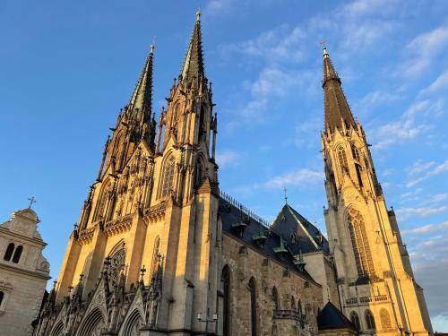 a large cathedral with two towers on top of it at Pension Moravia in Olomouc