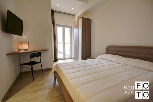 Tempat tidur dalam kamar di La Perla del Mare di Polignano Apartments