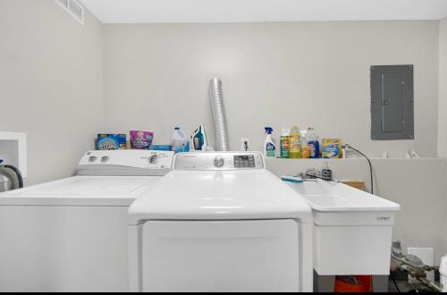 a white kitchen with a sink and a dishwasher at Cozy Private Room in Hammond, IN - 2 in Hammond