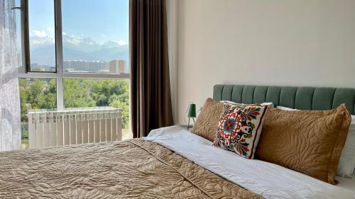 Photo de la galerie de l'établissement Лучший вид на горы из уютной квартиры, à (( Gornyy Gigant ))