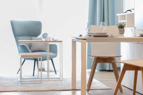 a living room with a table and chairs at NINO-Boardinghouse 18 in Nordhorn
