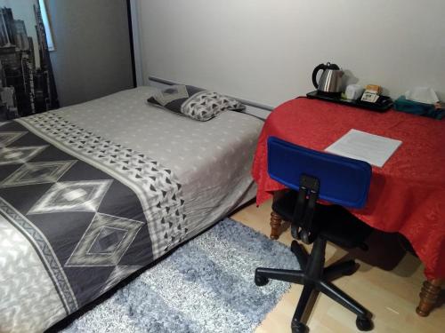 Ένα ή περισσότερα κρεβάτια σε δωμάτιο στο Chambre Grand lit New York