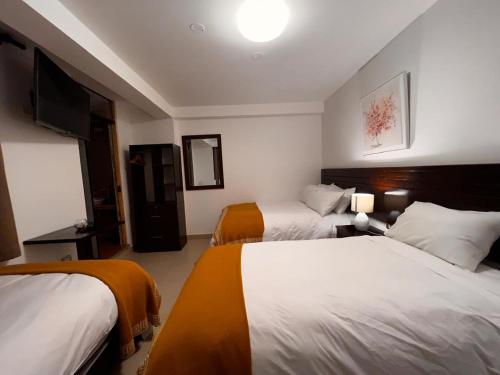 Postel nebo postele na pokoji v ubytování PisonayMapiHotelBoutique