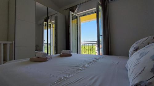Postel nebo postele na pokoji v ubytování Villa Estera