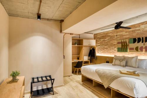 Ένα ή περισσότερα κρεβάτια σε δωμάτιο στο Caliza Roma Residences by Tasman