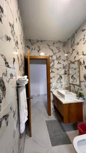 a bathroom with a sink and a mirror at Crown lll with Pool -3 Bedrooms close to Everything in Puerto Plata