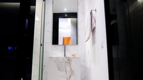 a bathroom with a sink and a mirror at VILLA Atlas in Sraghna