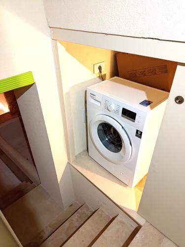 a washer and dryer in a tiny house at Fiorentini 22 - Suite Luxury con SPA in Matera