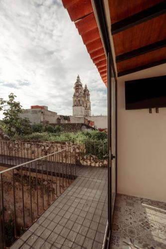 a balcony with a view of a building at Hotel Boutique Casa Jade in Campeche