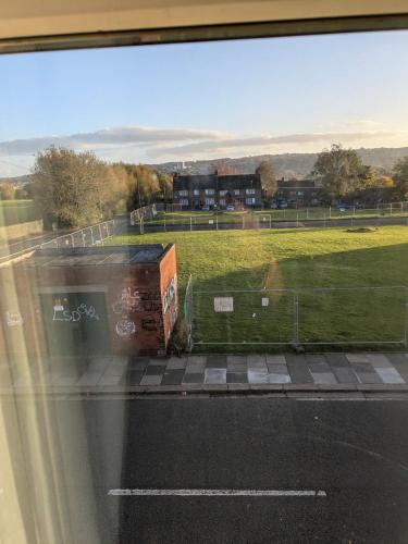 a view of a soccer field from a window at Druid Space in Saint Peters