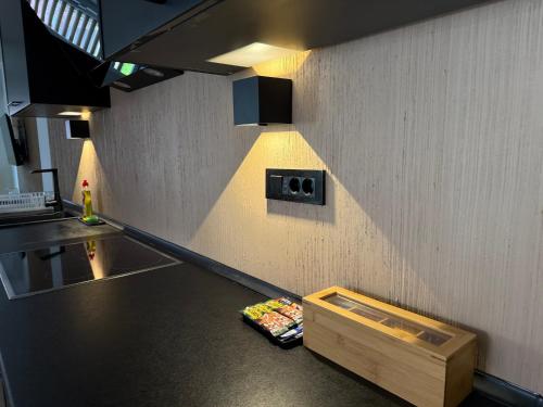 a kitchen with a counter with a drawer on the floor at Hestia Suite in Zaječar