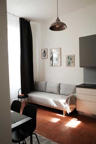 a living room with a couch and a table at Apartment Dusni Superior in Prague