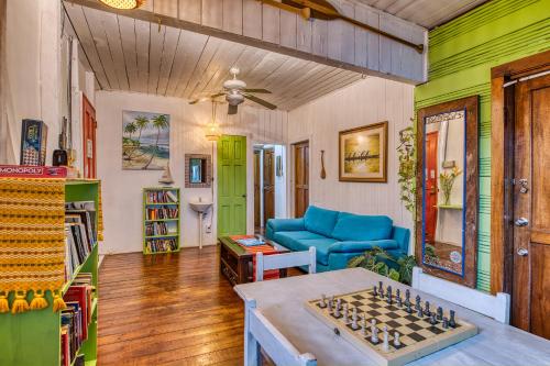a living room with a couch and a chess board at Saigon Bay Bed & Breakfast in Bocas del Toro