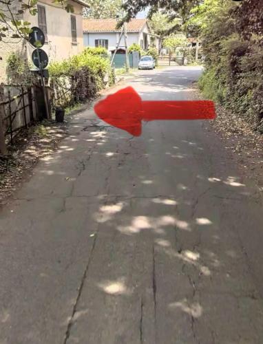 a red object in the middle of a street at SP Golden House in Bracciano