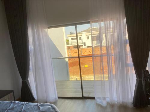 Кровать или кровати в номере holiday villa