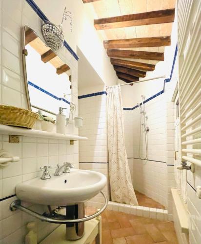 a bathroom with a sink and a shower at Spello House Altana in Spello