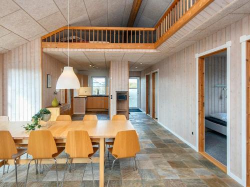 a dining room and kitchen with a table and chairs at Luxury Retreat by Fjord - By Traum Ferienwohnungen in Tarm
