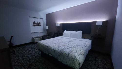 a hotel room with a bed in a room at Baymont by Wyndham South Bend Near Notre Dame in South Bend