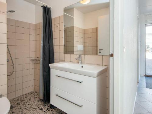 a bathroom with a sink and a shower at 4 star holiday home in Ringkøbing-By Traum in Ringkøbing