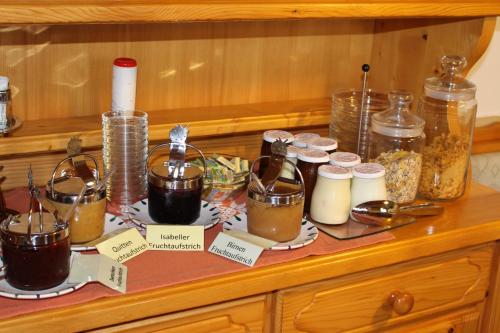 a counter with many different jars of food on it at Weingut Schwarzl in Ratsch an der Weinstraße