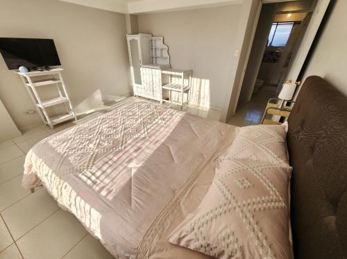 Ένα ή περισσότερα κρεβάτια σε δωμάτιο στο Apartamento en Cusco