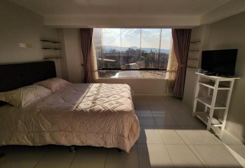 Postel nebo postele na pokoji v ubytování Apartamento en Cusco