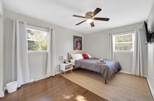 a bedroom with a bed and a ceiling fan at Cozy Private Room in Hammond, IN - 2 in Hammond