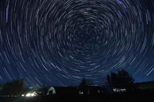 a star trails in the sky at night at Farm Stay Ezura Farm in Engaru