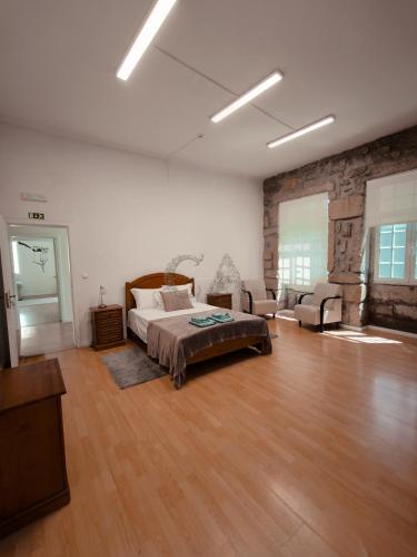 Ένα ή περισσότερα κρεβάτια σε δωμάτιο στο Casa dos artistas