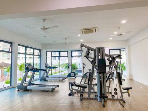 a gym with several tread machines in a room at 3R2B in Skudai, 10min to Sutera,Paradigm,UTM l 6-9pax in Lima Kedai