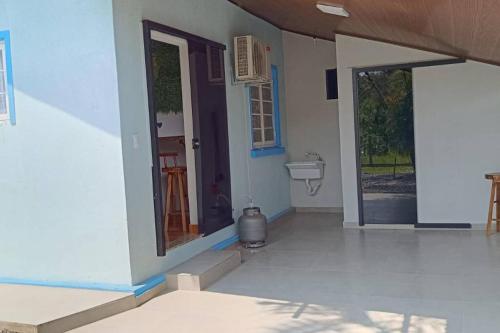 an empty house with a door and a sink at Blaues Haus 2 in Pomerode
