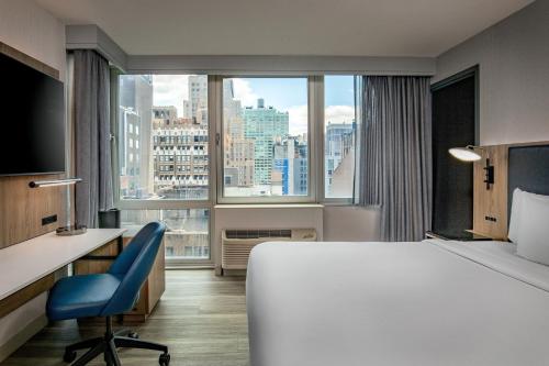 Postel nebo postele na pokoji v ubytování Courtyard by Marriott Times Square West